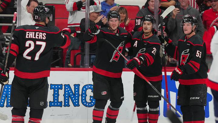 Oct 13, 2026; Raleigh, North Carolina, USA;  Carolina Hurricanes right wing Andrei Svechnikov (37) celebrates his goal with right wing Jackson Blake (53), center Sebastian Aho (20), and left wing Nikolaj Ehlers (27) against the Washington Capitals during the third period at Lenovo Center.  Mandatory Credit: James Guillory-Imagn Images