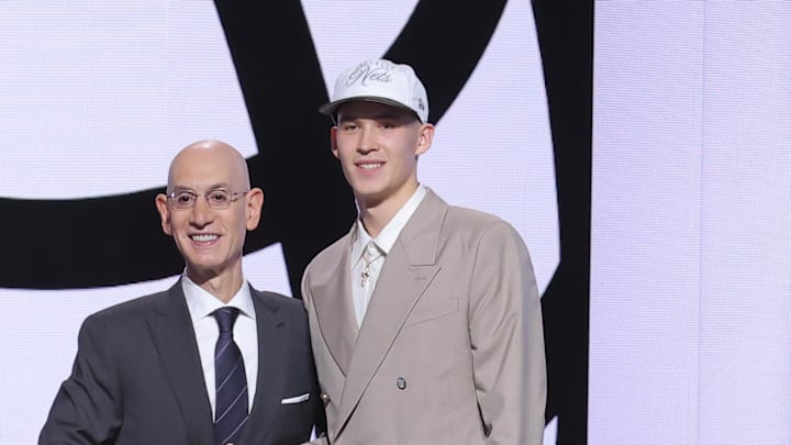 Jun 25, 2025; Brooklyn, NY, USA;  Egor Demin stands with NBA commissioner Adam Silver after being selected as the eighth pick by the Brooklyn Nets in the first round of the 2025 NBA Draft at Barclays Center. Mandatory Credit: Brad Penner-Imagn Images