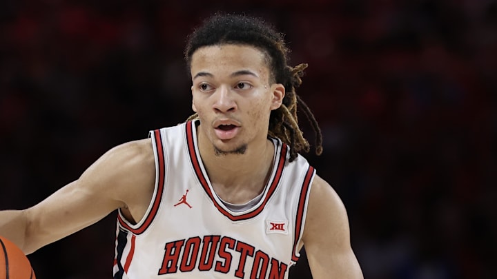 Mar 4, 2026; Houston, Texas, USA;   Houston Cougars guard Kingston Flemings (4) dribbles against Baylor Bears in the first half at Fertitta Center. Mandatory Credit: Thomas Shea-Imagn Images