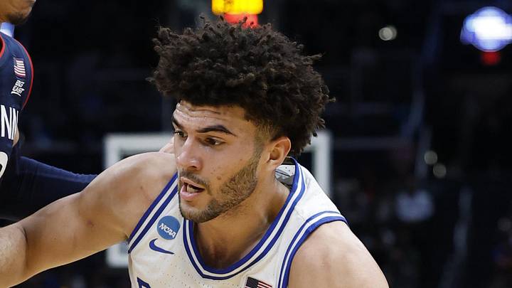 Mar 29, 2026; Washington, DC, USA; Duke Blue Devils forward Cameron Boozer (12) goes to the basket against UConn Huskies forward Jayden Ross (23) in the first half during an Elite Eight game of the East Regional of the men's 2026 NCAA Tournament at Capital One Arena. Mandatory Credit: Amber Searls-Imagn Images