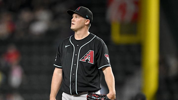 May 13, 2026; Arlington, Texas, USA;  Arizona Diamondbacks relief pitcher Paul Sewald (38) looks on after he gives up the game tying run against the Texas Rangers during the ninth inning at Globe Life Field. Mandatory Credit: Jerome Miron-Imagn Images