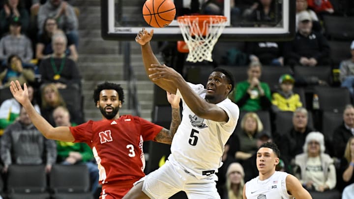 Feb 2, 2025; Eugene, Oregon, USA; Oregon Ducks guard TJ Bamba (5) intercepts a Nebraska pass during the first half at Matthew Knight Arena. Mandatory Credit: Craig Strobeck-Imagn Images