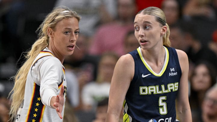Dallas, Texas, USA; Dallas Wings guard Paige Bueckers (5) and Indiana Fever guard Sophie Cunningham (8) in action during the game between the Dallas Wings and the Indiana Fever at the American Airlines Center. Mandatory Credit: Jerome Miron-Imagn Images