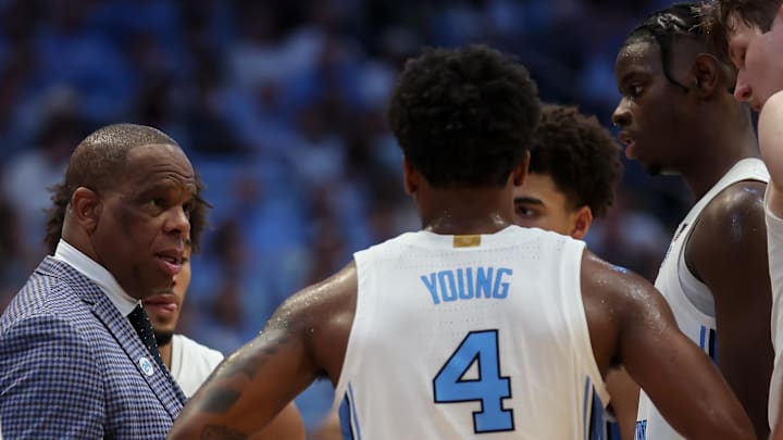 Jan 10, 2026; Chapel Hill, North Carolina, USA; North Carolina Tar Heels head coach Hubert Davis speaks to the team during a time out against the Wake Forest Demon Deacons during the second half at Dean E. Smith Center. Mandatory Credit: Cory Knowlton-Imagn Images