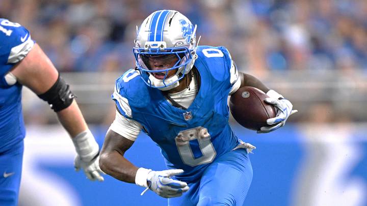 Sep 13, 2026; Detroit, Michigan, USA;  Detroit Lions running back Jahmyr Gibbs (0) carries the ball as New Orleans Saints defensive tackle Davon Godchaux (92) defends in overtime at Ford Field.  Mandatory Credit: Lon Horwedel-Imagn Images