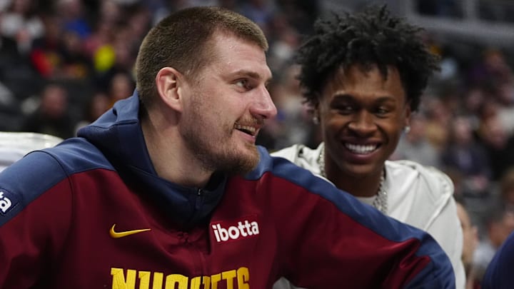 Feb 6, 2025; Denver, Colorado, USA; Denver Nuggets center Nikola Jokic (15) reacts from the bench in the second half against the Orlando Magic at Ball Arena. Mandatory Credit: Ron Chenoy-Imagn Images