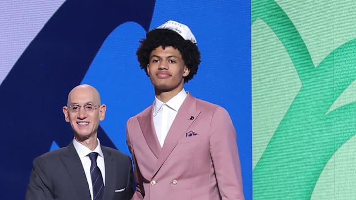 Jun 25, 2025; Brooklyn, NY, USA; Joan Beringer stands with NBA commissioner Adam Silver after being selected as the 17th pick by the Minnesota Timberwolves in the first round of the 2025 NBA Draft at Barclays Center. Mandatory Credit: Brad Penner-Imagn Images Jun 25, 2025; Brooklyn, NY, USA; Joan Beringer stands with NBA commissioner Adam Silver after being selected as the 17th pick by the Minnesota Timberwolves in the first round of the 2025 NBA Draft at Barclays Center. Mandatory Credit: Brad Penner-Imagn Images
