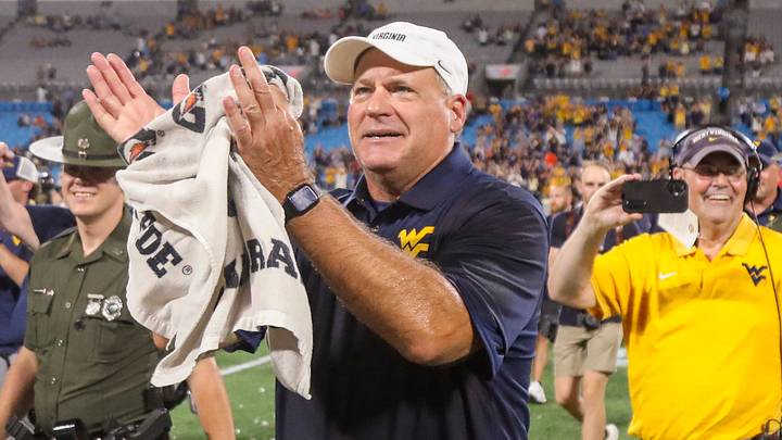 Sep 19, 2026; Charlotte, North Carolina, USA; West Virginia Mountaineers head coach Rich Rodriguez celebrates after defeating the Virginia Cavaliers at Bank of America Stadium. Mandatory Credit: Ben Queen-Imagn Images