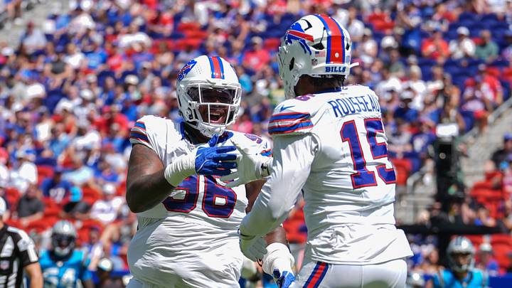 Aug 15, 2026; Orchard Park, New York, USA; Buffalo Bills defensive tackle Deone Walker (96) reacts to getting a sack with Buffalo Bills linebacker Greg Rousseau (15) during the first half at New Highmark Stadium. Mandatory Credit: Gregory Fisher-Imagn Images