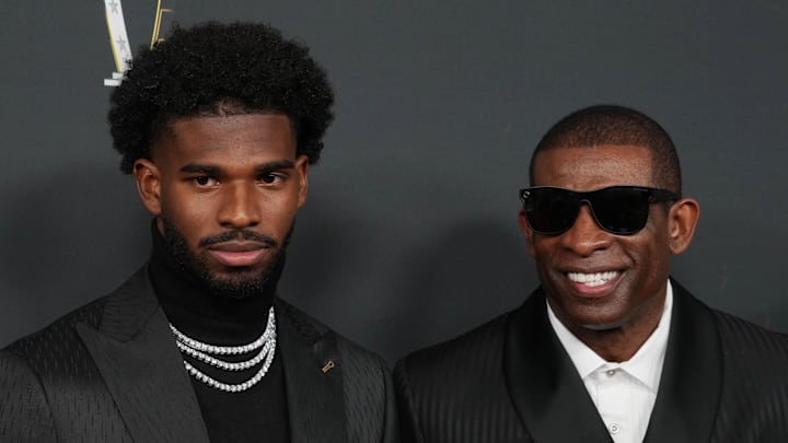 Feb 6, 2025; New Orleans, LA, USA;  Deion Sanders (right) with his son Shedeur Sanders on the red carpet before Super Bowl LIX NFL Honors at Saenger Theatre. Mandatory Credit: Kirby Lee-Imagn Images