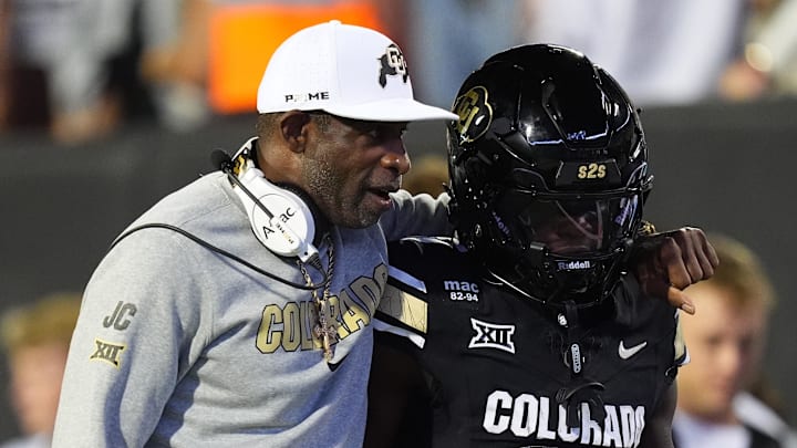 Sep 20, 2025; Boulder, Colorado, USA; Colorado Buffaloes head coach Deion Sanders and wide receiver Isaiah Hardge (17) during the first quarter against the Wyoming Cowboys at Folsom Field. Mandatory Credit: Ron Chenoy-Imagn Images