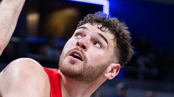 Portland Trail Blazers center Donovan Clingan shoots the ball while Indiana Pacers center Jay Huff defends. Portland Trail Blazers center Donovan Clingan shoots the ball while Indiana Pacers center Jay Huff defends.