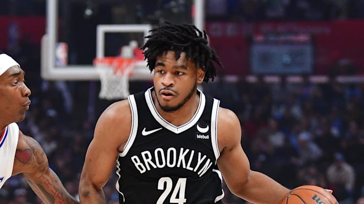 Jan 21, 2024; Los Angeles, California, USA; Brooklyn Nets guard Cam Thomas (24) moves the ball against Los Angeles Clippers guard Terance Mann (14) during the first half at Crypto.com Arena. Mandatory Credit: Gary A. Vasquez-Imagn Images