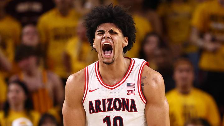 Jan 31, 2026; Tempe, Arizona, USA; Arizona Wildcats forward Koa Peat (10) celebrates alongside Arizona State Sun Devils forward Allen Mukeba (23) in the second half at Desert Financial Arena. Mandatory Credit: Mark J. Rebilas-Imagn Images
