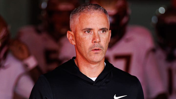 Nov 29, 2025; Gainesville, Florida, USA; Florida State Seminoles head coach Mike Norvell walks out of the tunnel before a game against the Florida Gators at Ben Hill Griffin Stadium. Mandatory Credit: Matt Pendleton-Imagn Images