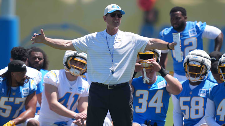 May 7, 2025; El Segundo CA, USA; Los Angeles Chargers coach Jim Harbaugh talks to players during rookie minicamp at The Bolt. Mandatory Credit: Kirby Lee-Imagn Images