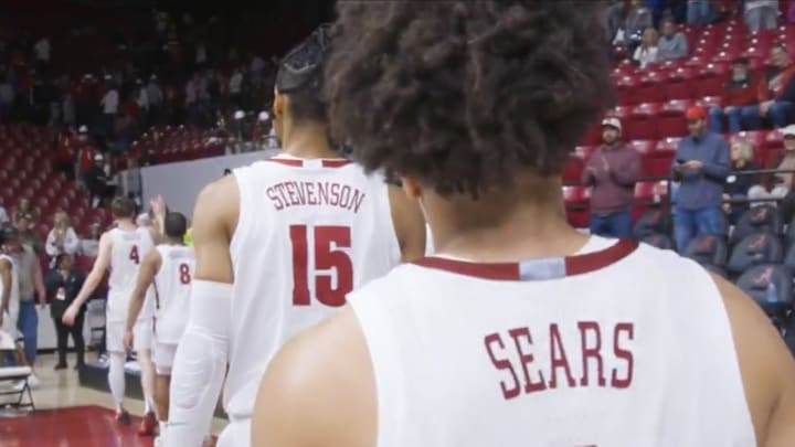 Alabama players face the remaining crowd after a loss to Florida on senior night.