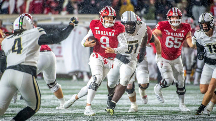Indiana's Kurtis Rourke (9) runs during the Indiana versus Purdue football game at Memorial Stadium on Saturday, Nov. 30, 2024.