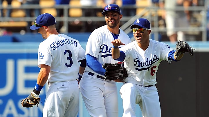 Dodgers second baseman Skip Schumaker (3), center fielder Matt Kemp (27) and third baseman Jerry Hairston Jr. (6) celebrate the 6-2 victory against the Pittsburgh Pirates at Dodger Stadium on April 7, 2013.