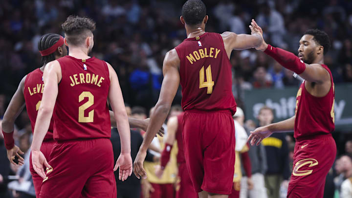 Jan 3, 2025; Dallas, Texas, USA;  Cleveland Cavaliers forward Evan Mobley (4) celebrates with Cleveland Cavaliers guard Donovan Mitchell (45) during the first half against the Dallas Mavericks at American Airlines Center. Mandatory Credit: Kevin Jairaj-Imagn Images