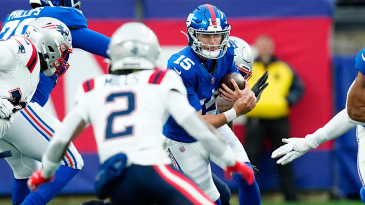 New York Giants quarterback Tommy DeVito (15) runs with the ball at MetLife Stadium, Sunday, November 26, 2023. New York Giants quarterback Tommy DeVito (15) runs with the ball at MetLife Stadium, Sunday, November 26, 2023.