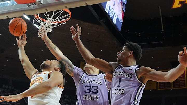 Iowa State Cyclones forward Joshua Jefferson (2) goes for a layup as Kansas State Wildcats' forward Coleman Hawkins (33) and forward David N'Guessan (1) defend during the second half in the Big-12 men’s basketball showdown at Hilton Coliseum on Feb 1, 2025 in Ames, Iowa. Iowa State Cyclones forward Joshua Jefferson (2) goes for a layup as Kansas State Wildcats' forward Coleman Hawkins (33) and forward David N'Guessan (1) defend during the second half in the Big-12 men’s basketball showdown at Hilton Coliseum on Feb 1, 2025 in Ames, Iowa.