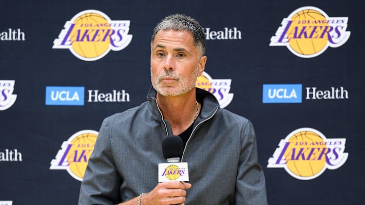 Sep 25, 2025; El Segundo, CA, USA; Los Angeles Lakers general manager Rob Pelinka, left, speaks during a press conference to preview the 2025-26 season at UCLA Health Training Center. Mandatory Credit: William Liang-Imagn Images