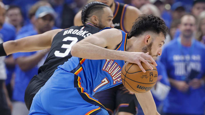 Apr 19, 2026; Oklahoma City, Oklahoma, USA; Oklahoma City Thunder center Chet Holmgren (7) drives around Phoenix Suns forward Dillon Brooks (3) in the first quarter during game one of the first round of the 2026 NBA Playoffs at Paycom Center. Mandatory Credit: Alonzo Adams-Imagn Images