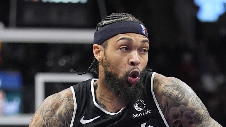 Toronto Raptors forward Brandon Ingram drives to the basket against San Antonio Spurs guard Devin Vassell.