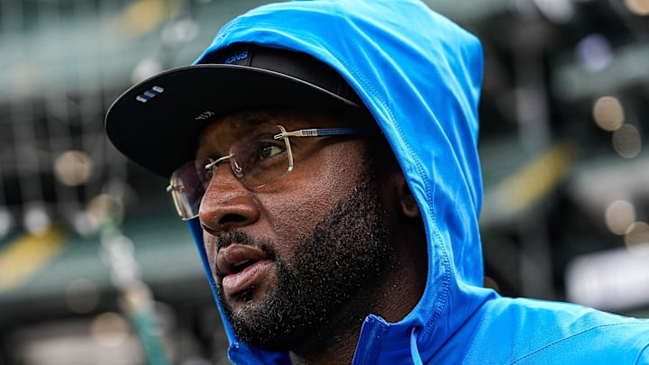 Lions defensive coordinator Kelvin Sheppard walks onto the field for warm up ahed of the Green Bay Packers game