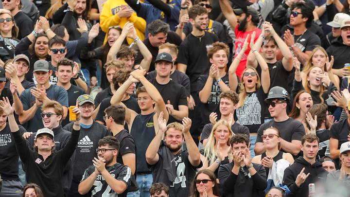Oct 10, 2026; Morgantown, West Virginia, USA; West Virginia Mountaineers fans cheer after a touchdown during the second quarter against the Arizona Wildcats at Milan Puskar Stadium. Mandatory Credit: Ben Queen-Imagn Images Oct 10, 2026; Morgantown, West Virginia, USA; West Virginia Mountaineers fans cheer after a touchdown during the second quarter against the Arizona Wildcats at Milan Puskar Stadium. Mandatory Credit: Ben Queen-Imagn Images