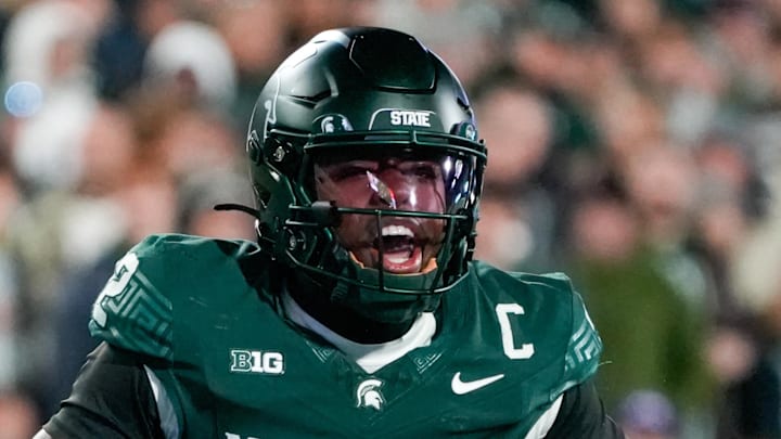 Oct 25, 2025; East Lansing, Michigan, USA; Michigan State Spartans quarterback Aidan Chiles (2) calls a play at the line of scrimmage against the Michigan Wolverines during the first half at Spartan Stadium. Mandatory Credit: Brendan Mullin-Imagn Images