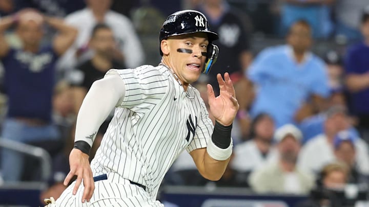 Oct 7, 2025; Bronx, New York, USA; New York Yankees outfielder Aaron Judge (99) is caught in a rundown in the third inning against the Toronto Blue Jays during game three of the ALDS round for the 2025 MLB playoffs at Yankee Stadium. Mandatory Credit: Wendell Cruz-Imagn Images
