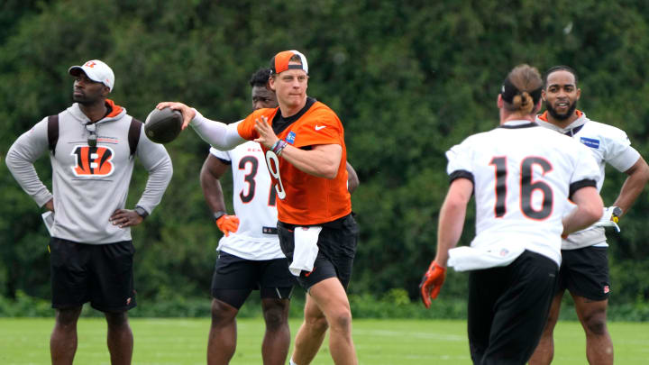 Bengals quarterbacks Jake Browning, left, and Joe Burrow during an off-season workout at the practice fields outside of Paycor Stadium Tuesday, May 7, 2024. Burrow is recovering from wrist surgery after a season-ending injury he suffered in a Week 11.