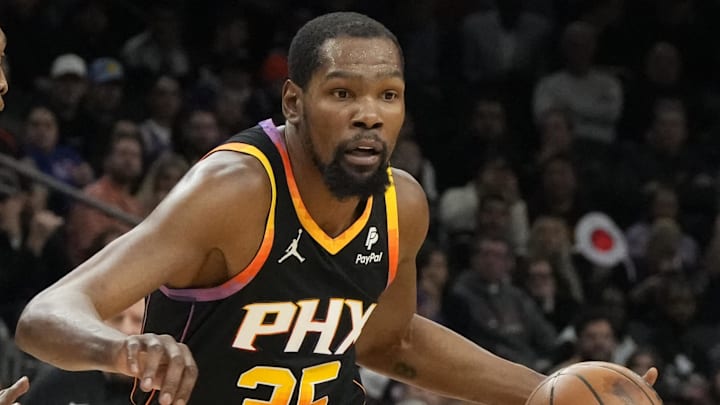 Phoenix Suns forward Kevin Durant drives on New York Knicks guard Immanuel Quickley. Mandatory Credit: Rick Scuteri-Imagn Images