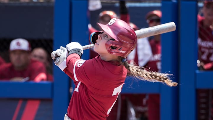 Oklahoma Sooners outfielder Kasidi Pickering (7) hits a fly ball for an out in the first inning against the Texas Longhorns during the NCAA Softball Women's College World Series at Devon Park. 