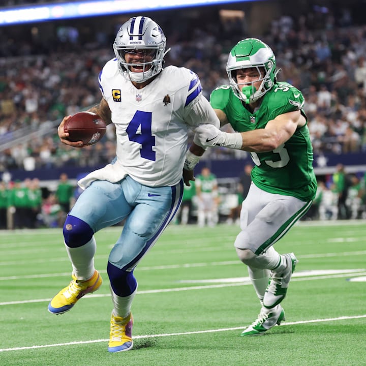 Dallas Cowboys quarterback Dak Prescott (4) runs with the ball in attempt to score a touchdown.