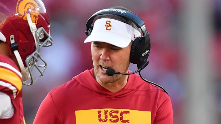 Nov 16, 2024; Los Angeles, California, USA; Southern California Trojans head coach Lincoln Riley greets quarterback Jayden Maiava (14) after scoring a touchdown against the Nebraska Cornhuskers during the second half at the Los Angeles Memorial Coliseum. 