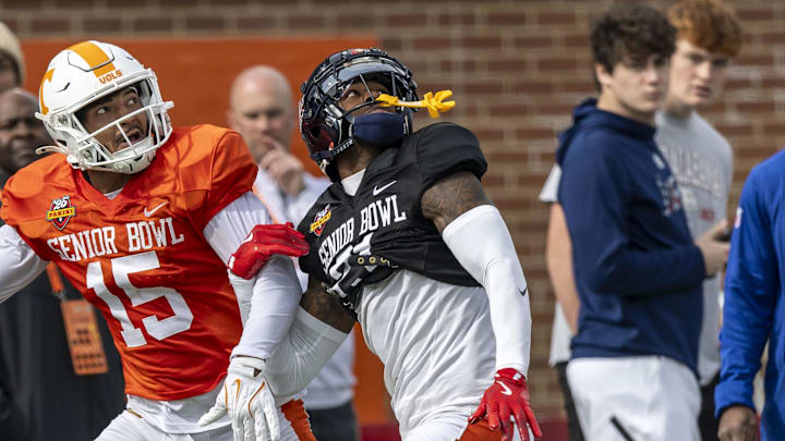 Jan 28, 2025; Mobile, AL, USA; American team wide receiver Bru McCoy III of Tennessee (15) battles with American team defensive back Trey Amos of Ole Miss (21) during Senior Bowl practice for the American team at Hancock Whitney Stadium. Mandatory Credit: Vasha Hunt-Imagn Images