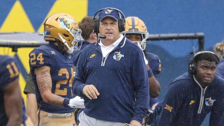 Sep 27, 2025; Morgantown, West Virginia, USA; West Virginia Mountaineers head coach Rich Rodriguez watches a play during the first quarter against the Utah Utes at Milan Puskar Stadium. Mandatory Credit: Ben Queen-Imagn Images