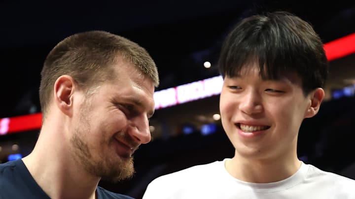 Denver Nuggets center Nikola Jokic and Portland Trail Blazers center Yang Hansen. Denver Nuggets center Nikola Jokic and Portland Trail Blazers center Yang Hansen.