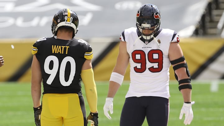 Former Wisconsin Badgers brothers Pittsburgh Steelers outside linebacker T.J. Watt (90) and Houston Texans defensive end J.J. Watt (99) before their game against at Heinz Field. The Steelers won 28-21 Former Wisconsin Badgers brothers Pittsburgh Steelers outside linebacker T.J. Watt (90) and Houston Texans defensive end J.J. Watt (99) before their game against at Heinz Field. The Steelers won 28-21