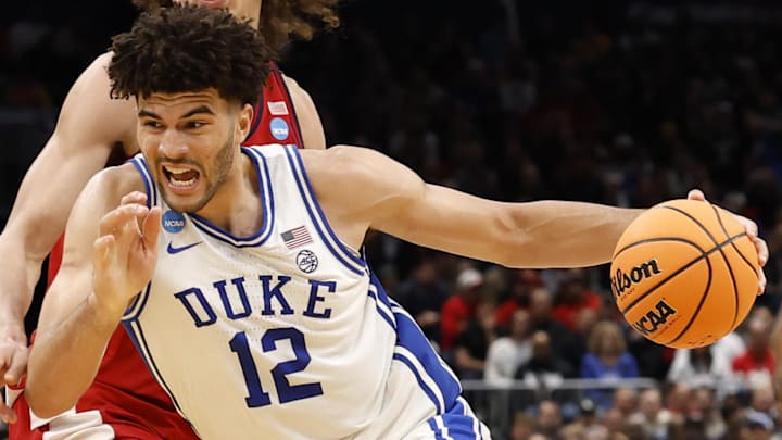 Mar 27, 2026; Washington, DC, USA; Duke Blue Devils forward Cameron Boozer (12) dribbles the ball past St. John's Red Storm forward Ruben Prey (17) in the second half during a Sweet Sixteen game of the East Regional of the men's 2026 NCAA Tournament at Capital One Arena. Mandatory Credit: Geoff Burke-Imagn Images Mar 27, 2026; Washington, DC, USA; Duke Blue Devils forward Cameron Boozer (12) dribbles the ball past St. John's Red Storm forward Ruben Prey (17) in the second half during a Sweet Sixteen game of the East Regional of the men's 2026 NCAA Tournament at Capital One Arena. Mandatory Credit: Geoff Burke-Imagn Images