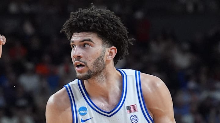 Mar 21, 2026; Greenville, SC, USA; Duke Blue Devils forward Cameron Boozer (12) moves the ball against Texas Christian University Horned Frogs forward Micah Robinson (5) during a second round game of the men's 2026 NCAA Tournament at Bon Secours Wellness Arena. Mandatory Credit: Jim Dedmon-Imagn Images