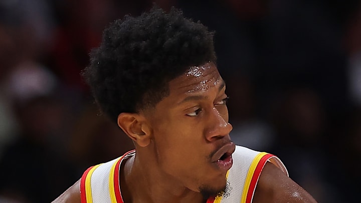 De'Andre Hunter #12 of the Atlanta Hawks reacts after making a basket against the Charlotte Hornets.
