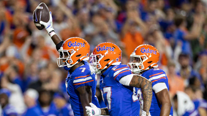 Oct 19, 2024; Gainesville, Florida, USA; Florida Gators defensive back Trikweze Bridges (7) and Florida Gators defensive back Dijon Johnson (27) celebrate an interception against the Kentucky Wildcats during the first half at Ben Hill Griffin Stadium. Mandatory Credit: Matt Pendleton-Imagn Images