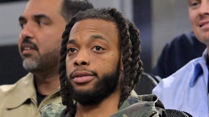 Los Angeles Clippers Darius Garland sits in the stands as he watches the game against the Cleveland Cavaliers.