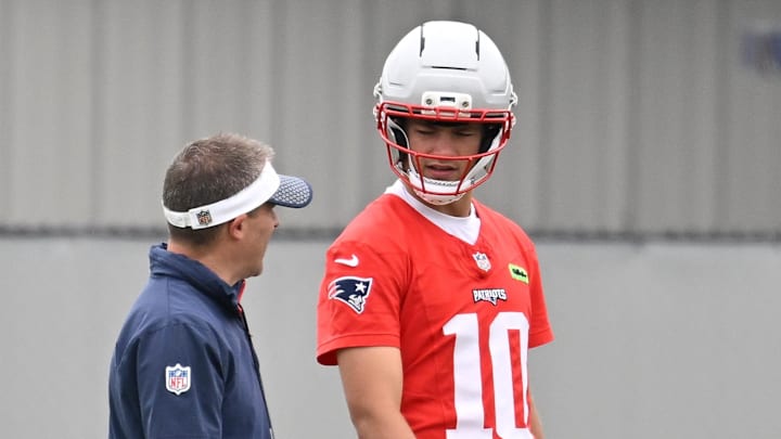 Jun 9, 2025; Foxborough, MA, USA; New England Patriots offensive coordinator Josh McDaniels works with quarterback Drake Maye (10) during minicamp at Gillette Stadium. Mandatory Credit: Eric Canha-Imagn Images