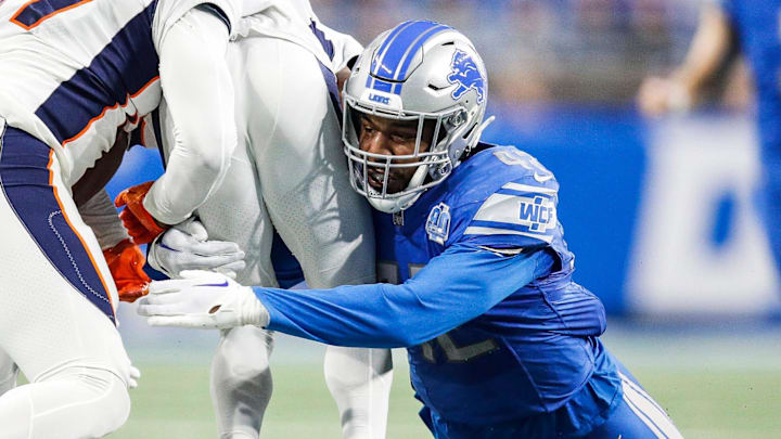 Detroit Lions linebacker Jalen Reeves-Maybin tackles Denver Broncos kick returner Marvin Mims Jr. during the first half at Ford Field in Detroit on Saturday, Dec. 16, 2023.