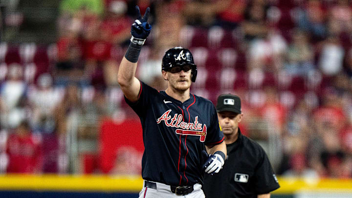 Atlanta Braves catcher Sean Murphy (12) gestures after hitting a RBI double in the eighth inning between Cincinnati Reds and Atlanta Braves at Great American Ball Park in Cincinnati on July 30, 2025.